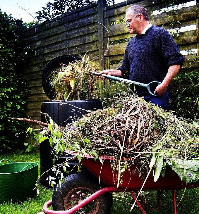 A man works compost.